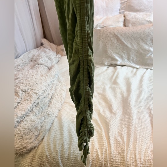 Green T-shirt dress with ruching and ties on sides - Picture 2 of 3